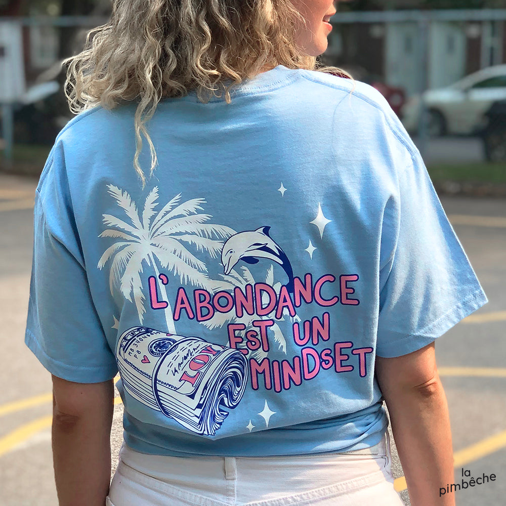 Abundance is a Mindset. Local business from Montreal. Artist La Pimbêche. Support local. T-shirt baby blue screen print graphic design.