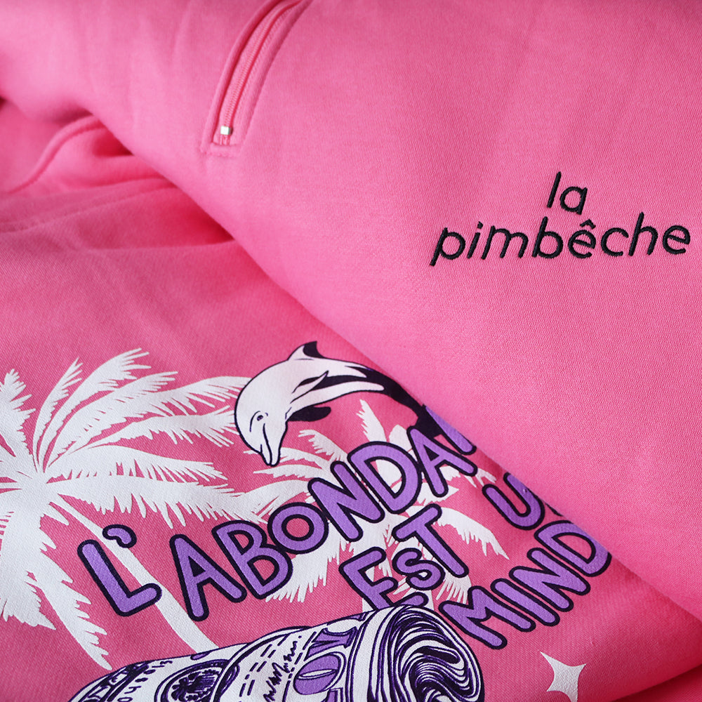 L'abondance est un état d'esprit. Entreprise locale de Montréal. Artiste La Pimbêche. Soutenez le local. Sweat-shirt polo rose sérigraphié design graphique.