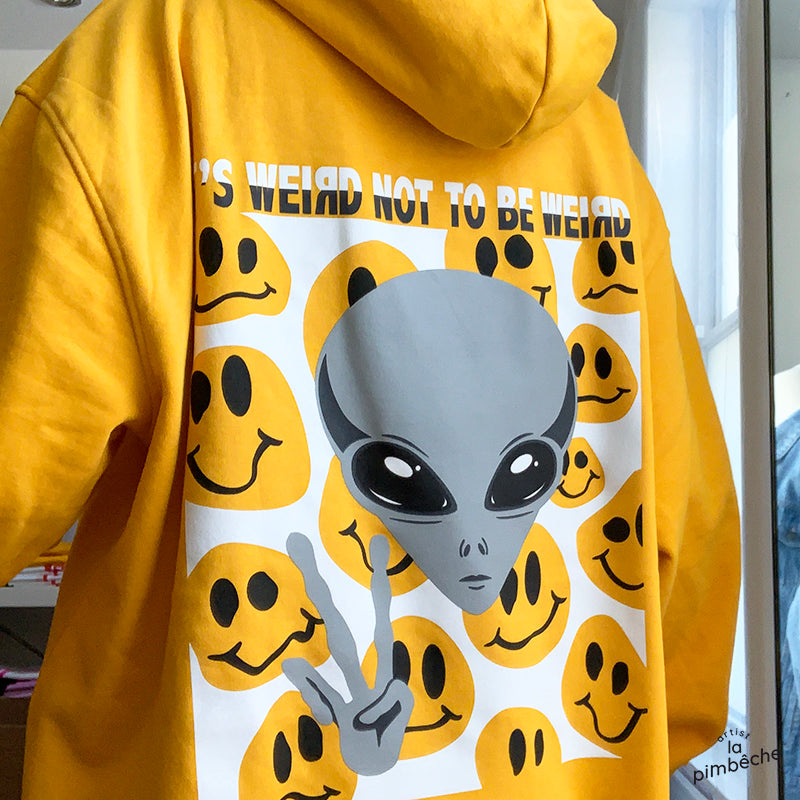 Yellow hoodie UFO happy faces It's weird not to be weird by the artist La Pimbeche from Montreal 
